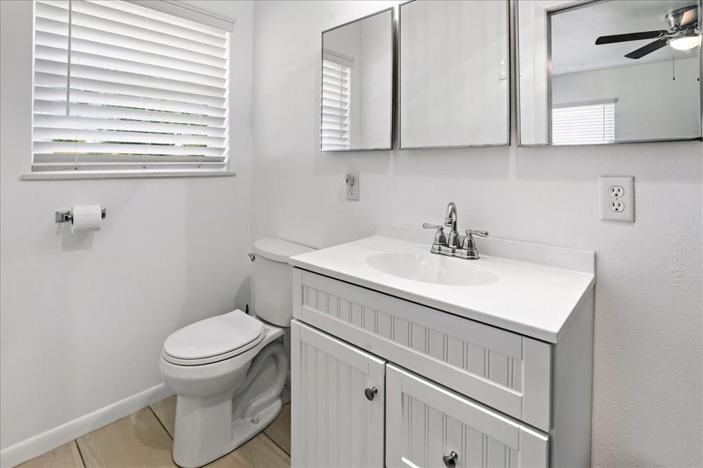 12657 Alma Street Tyler, TX 75704 - Photo 26 of 36 a bathroom with a sink toilet and a mirror
