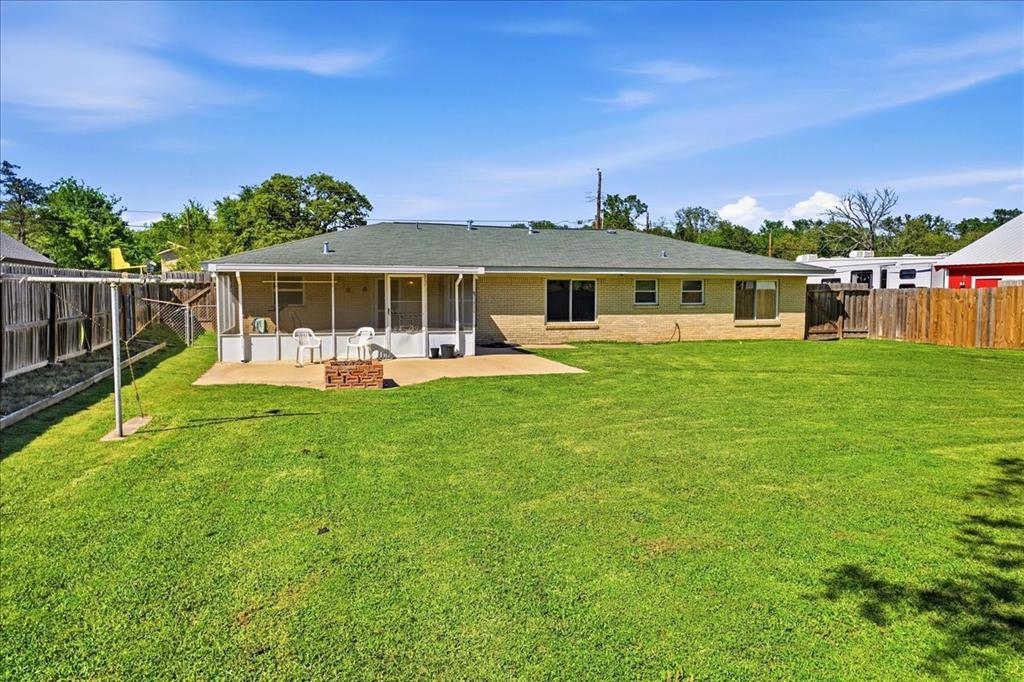 12657 Alma Street Tyler, TX 75704 - Photo 28 of 36 a front view of house with yard outdoor seating and green space