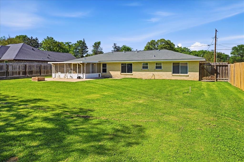 12657 Alma Street Tyler, TX 75704 - Photo 29 of 36 a front view of a house with a garden