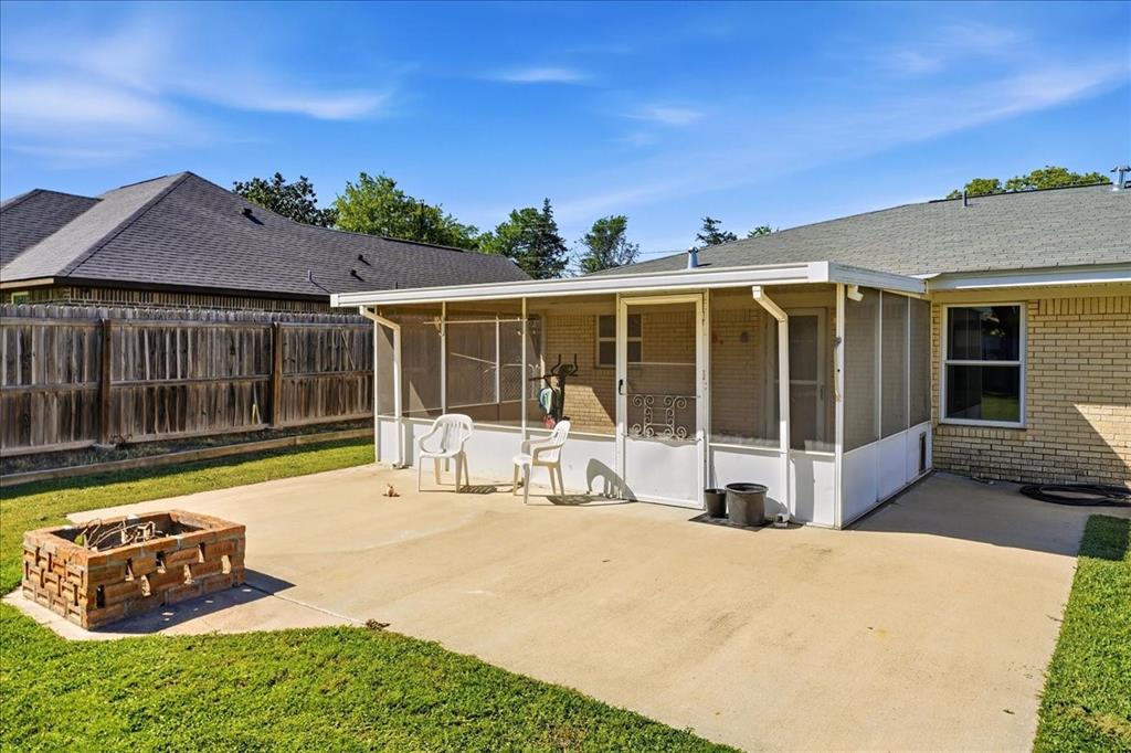 12657 Alma Street Tyler, TX 75704 - Photo 31 of 36 a view of a house with backyard sitting area and porch