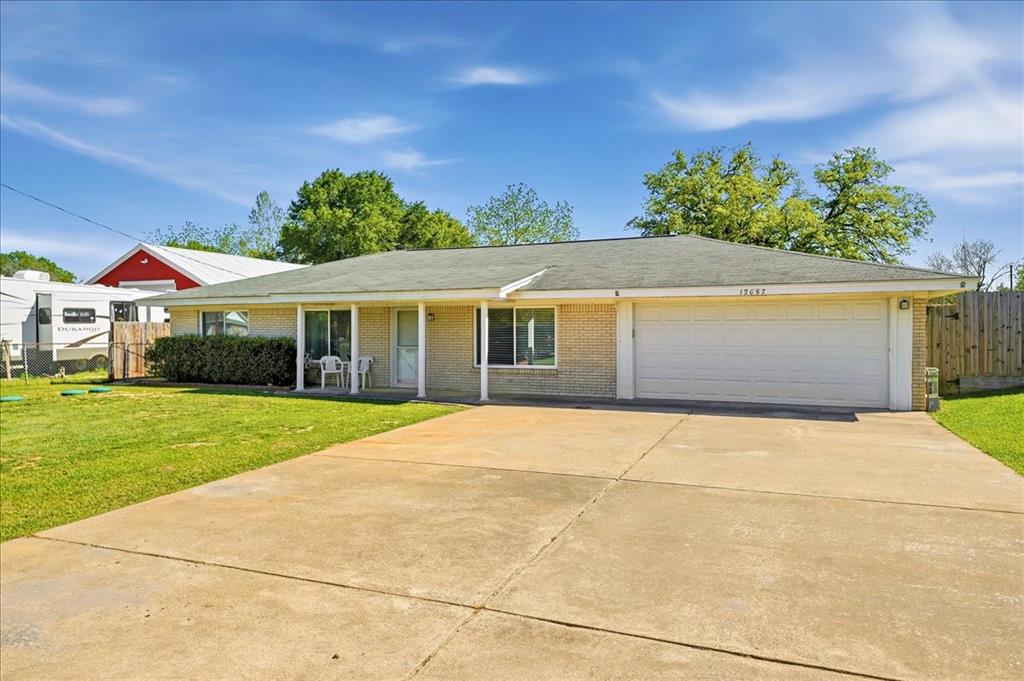 12657 Alma Street Tyler, TX 75704 - Photo 32 of 36 a front view of a house with a garden