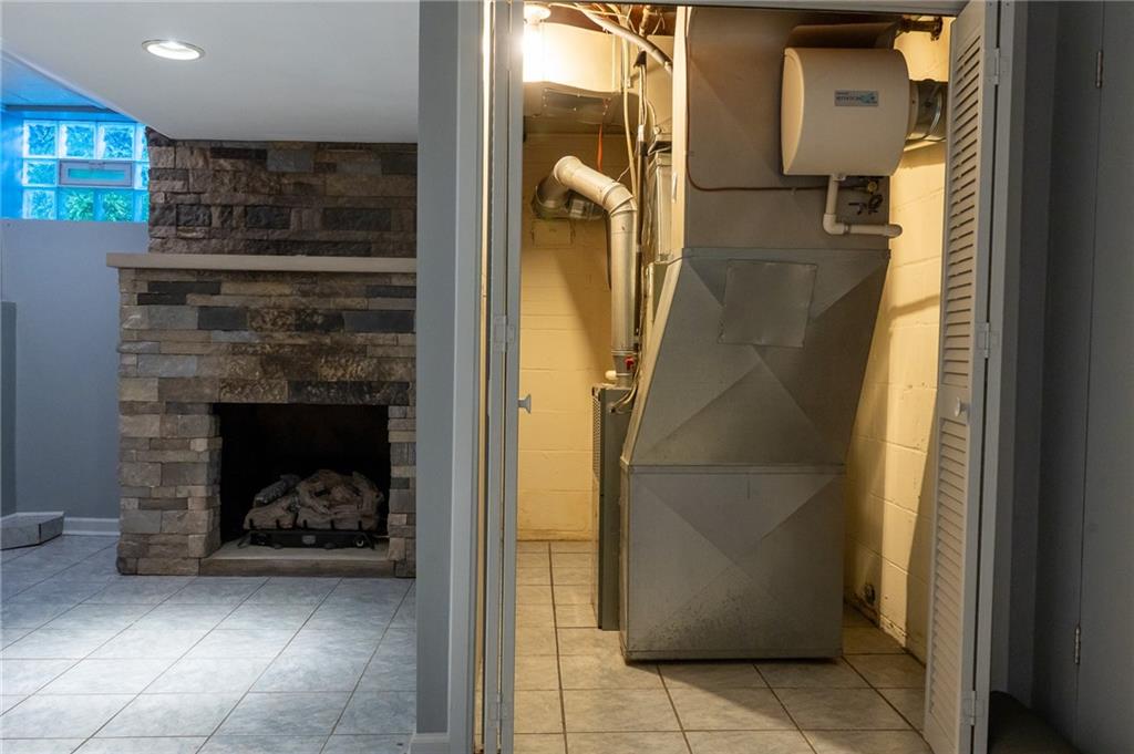 2450 Lytle Road Bethel Park, PA 15102 - Photo 46 of 50 Stone fireplace and HVAC