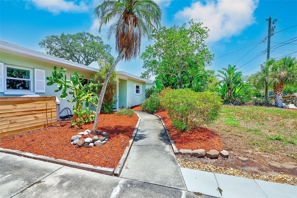 14079 Victoria Road Largo, FL 33774 - Photo 29 of 46 a view of backyard with plants and outdoor seating