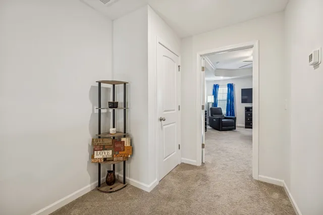 a spacious bedroom with a bed and couch