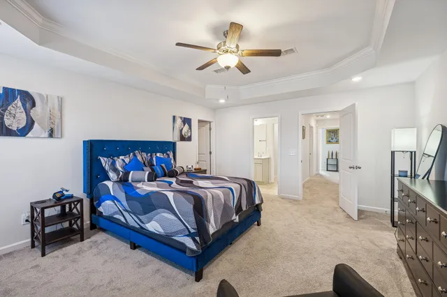 a view of walk in closet with clothes