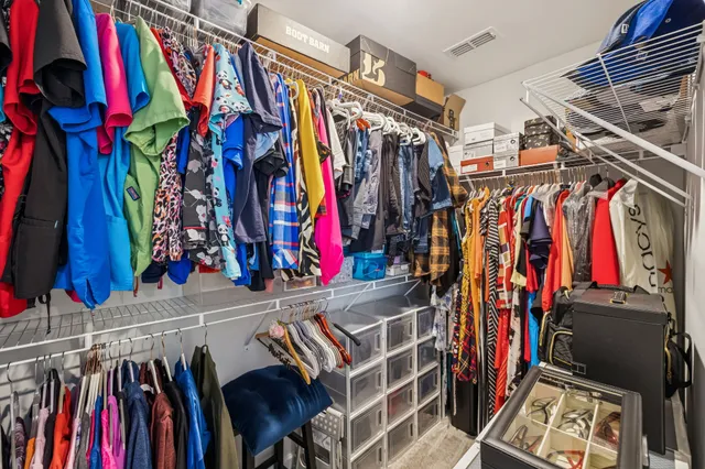 a bathroom with a double vanity sink mirror and shower