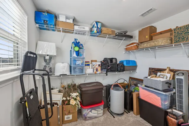 a bathroom with a sink a toilet and shower curtain