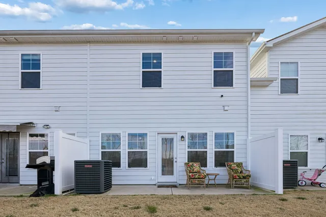 a front view of a house with parking space