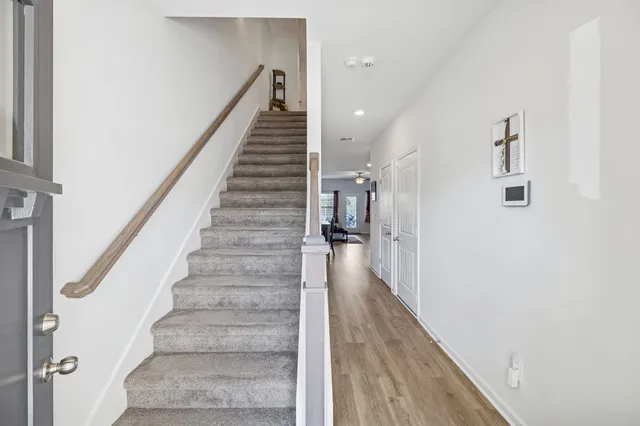 a view of staircase with white walls