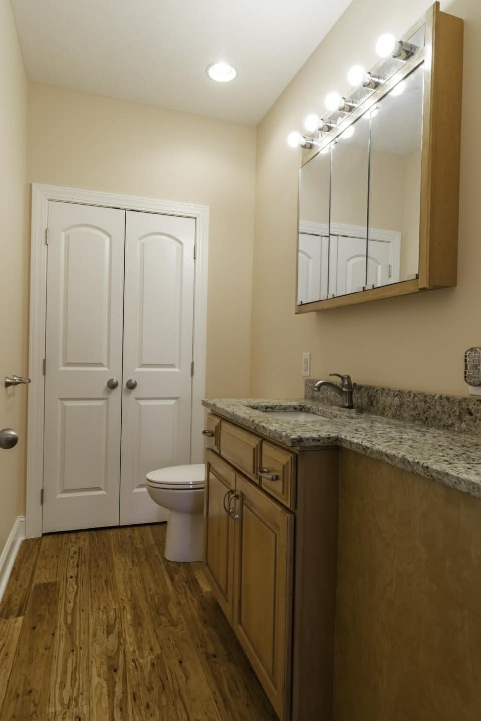 637 River Road Clifton, TN 38425 - Photo 11 of 19 a bathroom with a granite countertop sink toilet and a mirror