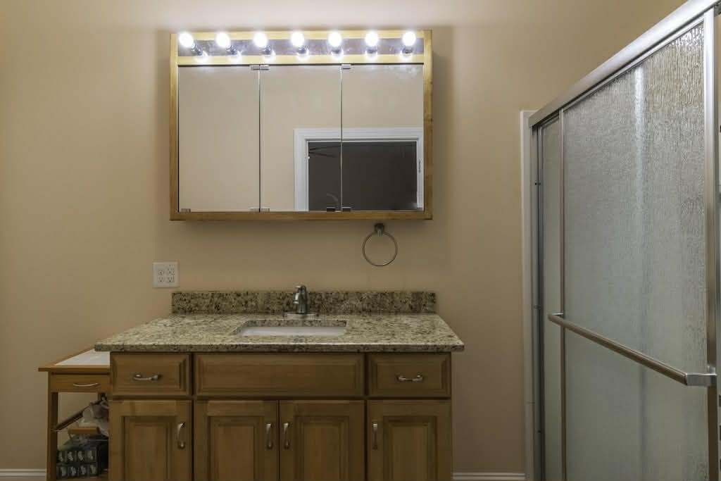 637 River Road Clifton, TN 38425 - Photo 12 of 19 a bathroom with a sink vanity and mirror