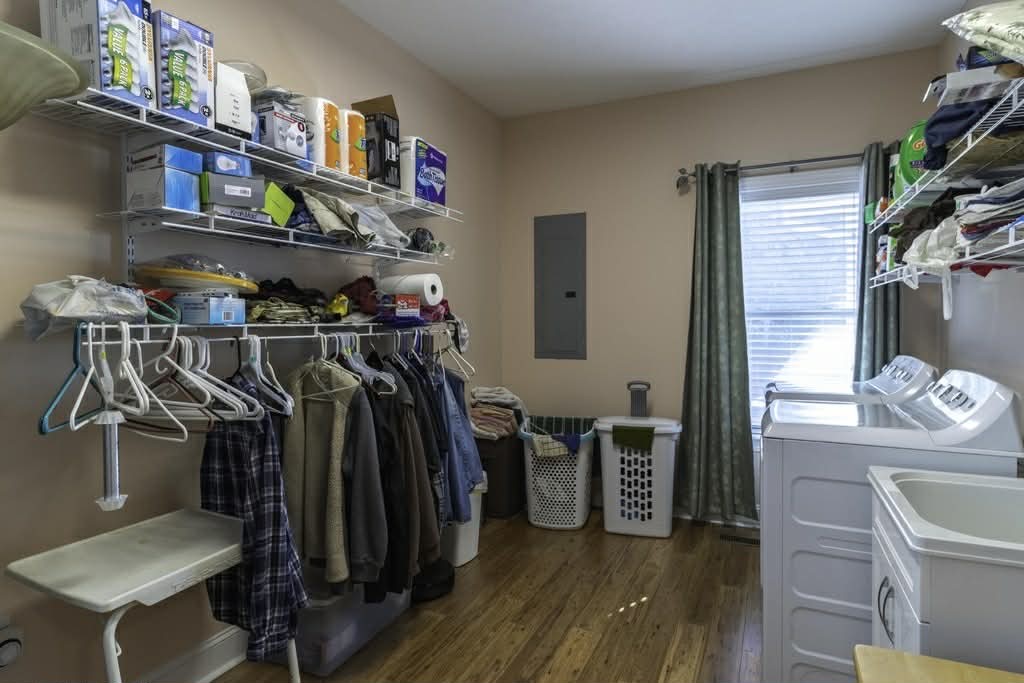 637 River Road Clifton, TN 38425 - Photo 17 of 19 a view of walk in closet with clothes and shoes