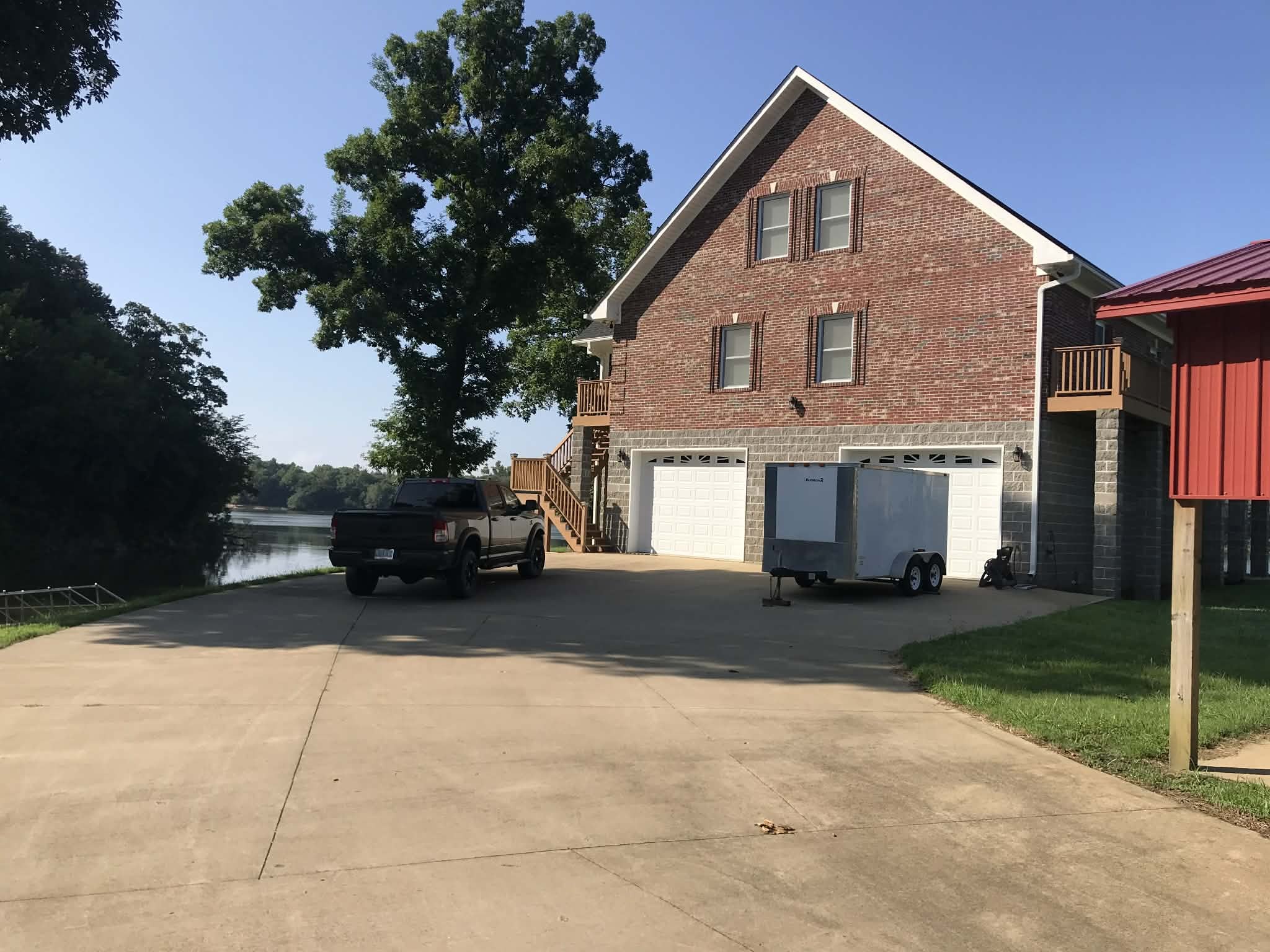637 River Road Clifton, TN 38425 - Photo 19 of 19 a front view of a house with a yard and garage