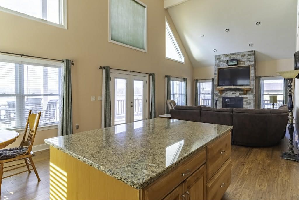 637 River Road Clifton, TN 38425 - Photo 5 of 19 a dining hall with stainless steel appliances granite countertop a kitchen view and living room