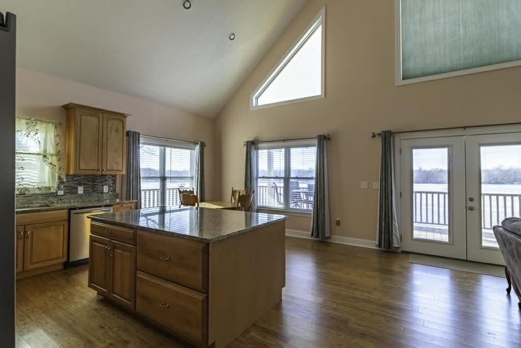 637 River Road Clifton, TN 38425 - Photo 6 of 19 a living room with stainless steel appliances granite countertop a sink and dishwasher with wooden floor