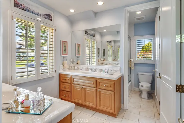 a bathroom with a sink a vanity and a toilet