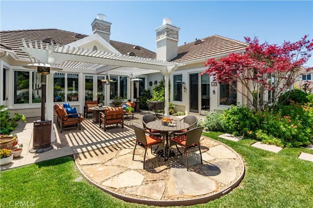 a view of a house with sitting area and furniture