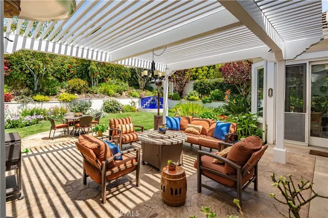 a outdoor living space with furniture and garden view