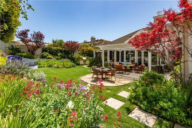 a view of a house with swimming pool garden and patio