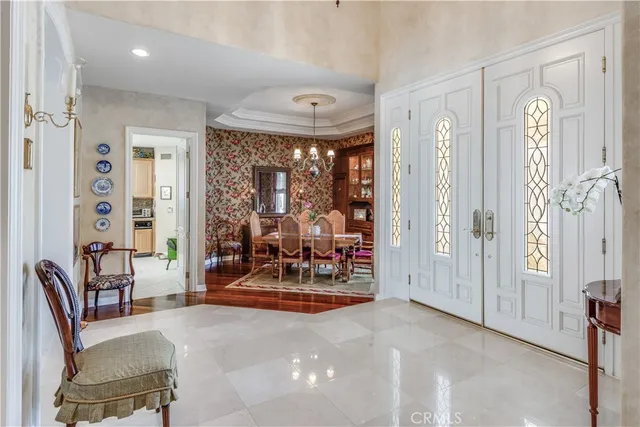 a view of a livingroom with furniture and a large window