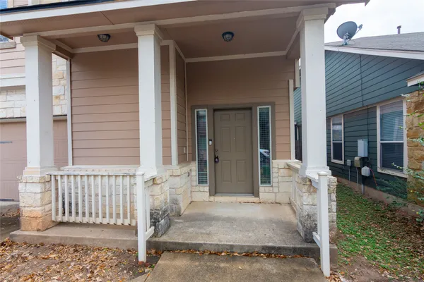 a front view of a house with a porch