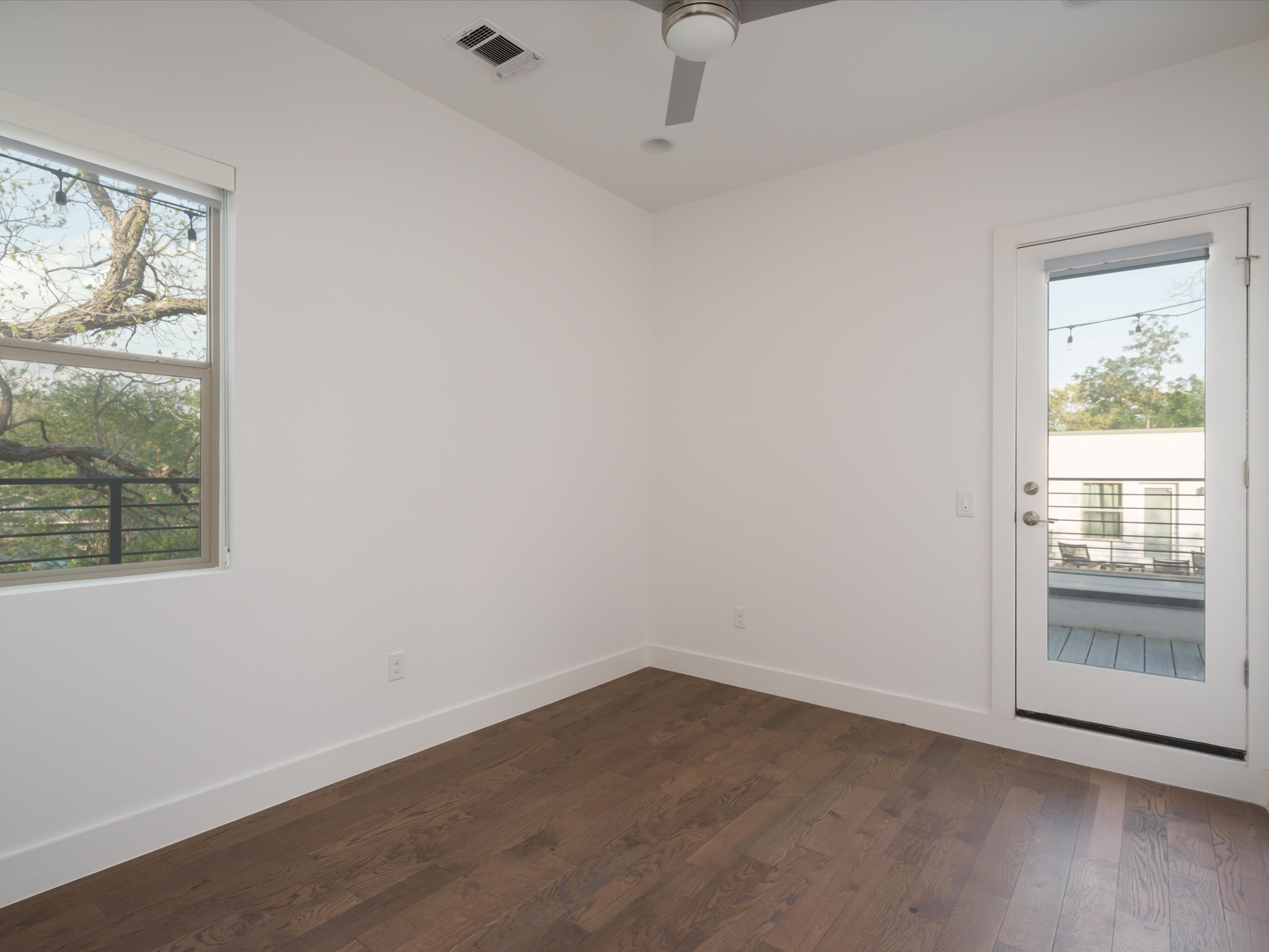 615 Jewell Street Austin, TX 78704 - Photo 17 of 25 The other secondary bedroom offers walkout access to the terrace.