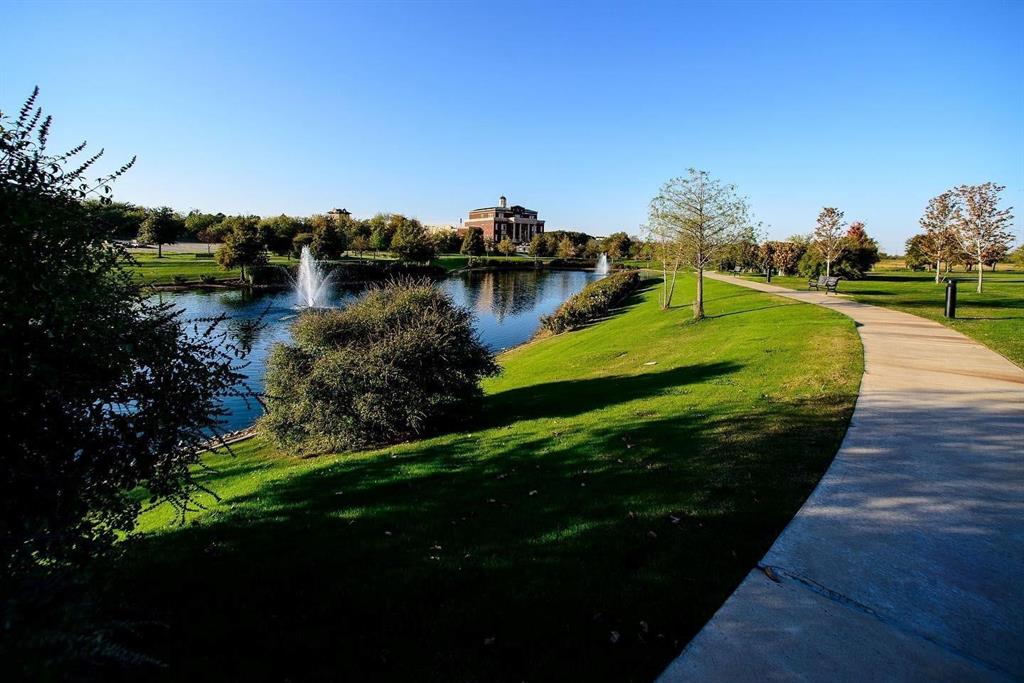 1530 Meeting Street, Unit 1304 Southlake, TX 76092 - Photo 32 of 40 a view of a lake with a yard