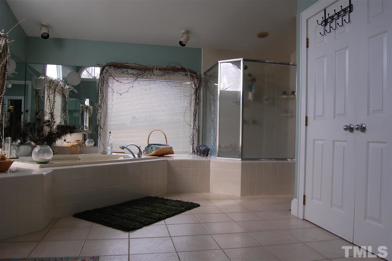 6740 Good Life Road Wendell, NC 27591 - Photo 15 of 25 a kitchen with a sink a refrigerator and cabinets
