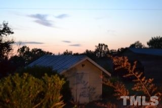 6740 Good Life Road Wendell, NC 27591 - Photo 22 of 25 a view of roof with a yard