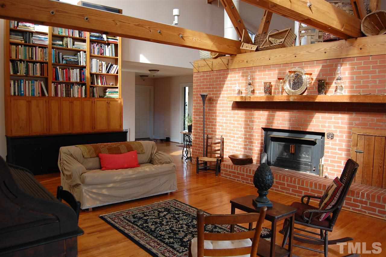 6740 Good Life Road Wendell, NC 27591 - Photo 7 of 25 a living room with furniture and a fireplace