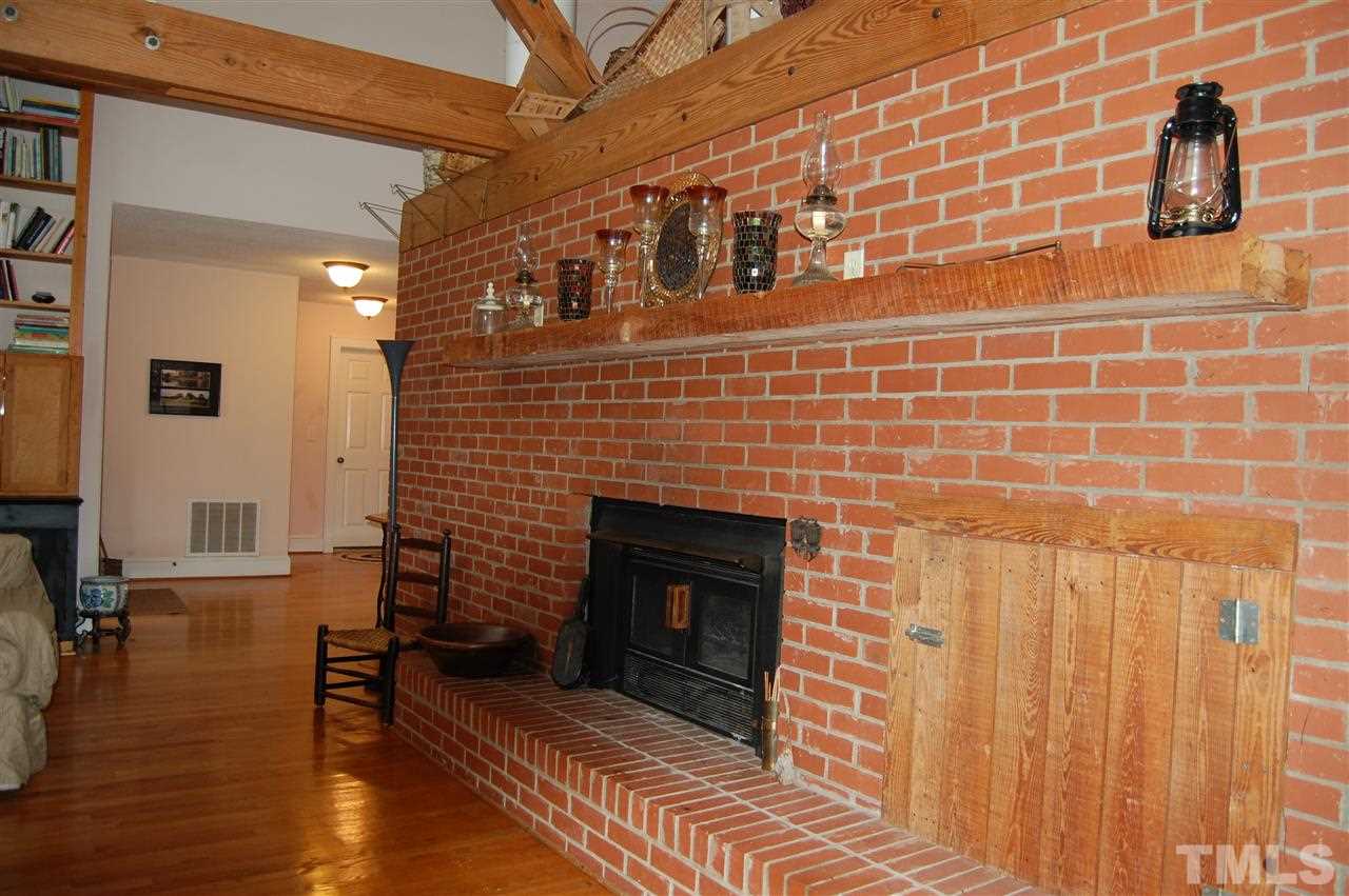 6740 Good Life Road Wendell, NC 27591 - Photo 8 of 25 a brick building with a fireplace