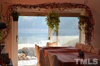 6740 Good Life Road Wendell, NC 27591 - Photo 10 of 25 a view of balcony with wooden floor and lake view
