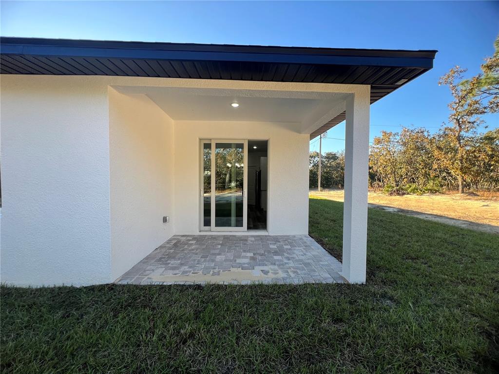 6173 North Matheson Drive Citrus Springs, FL 34434 - Photo 17 of 18 a view of backyard with garden