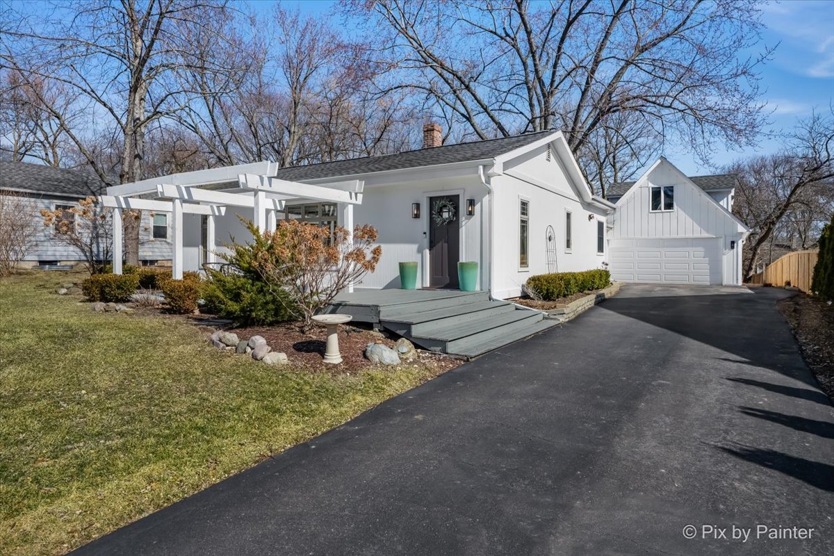 917 South Grove Avenue Barrington, IL 60010 - Photo 1 of 1 a front view of a house with garden