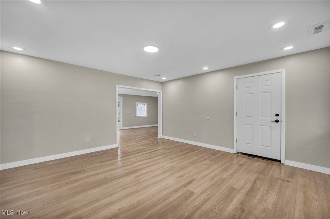 614 Weller Road Elyria, OH 44035 - Photo 22 of 39 Unfurnished room with light wood finished floors and recessed lighting