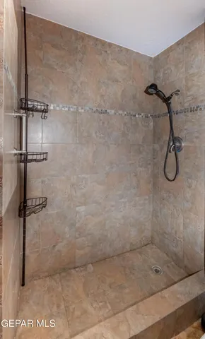a bathroom with a toilet sink and shower