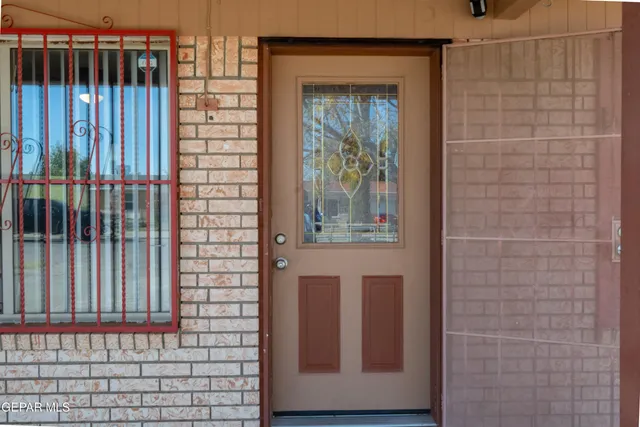 a view of a door and a window