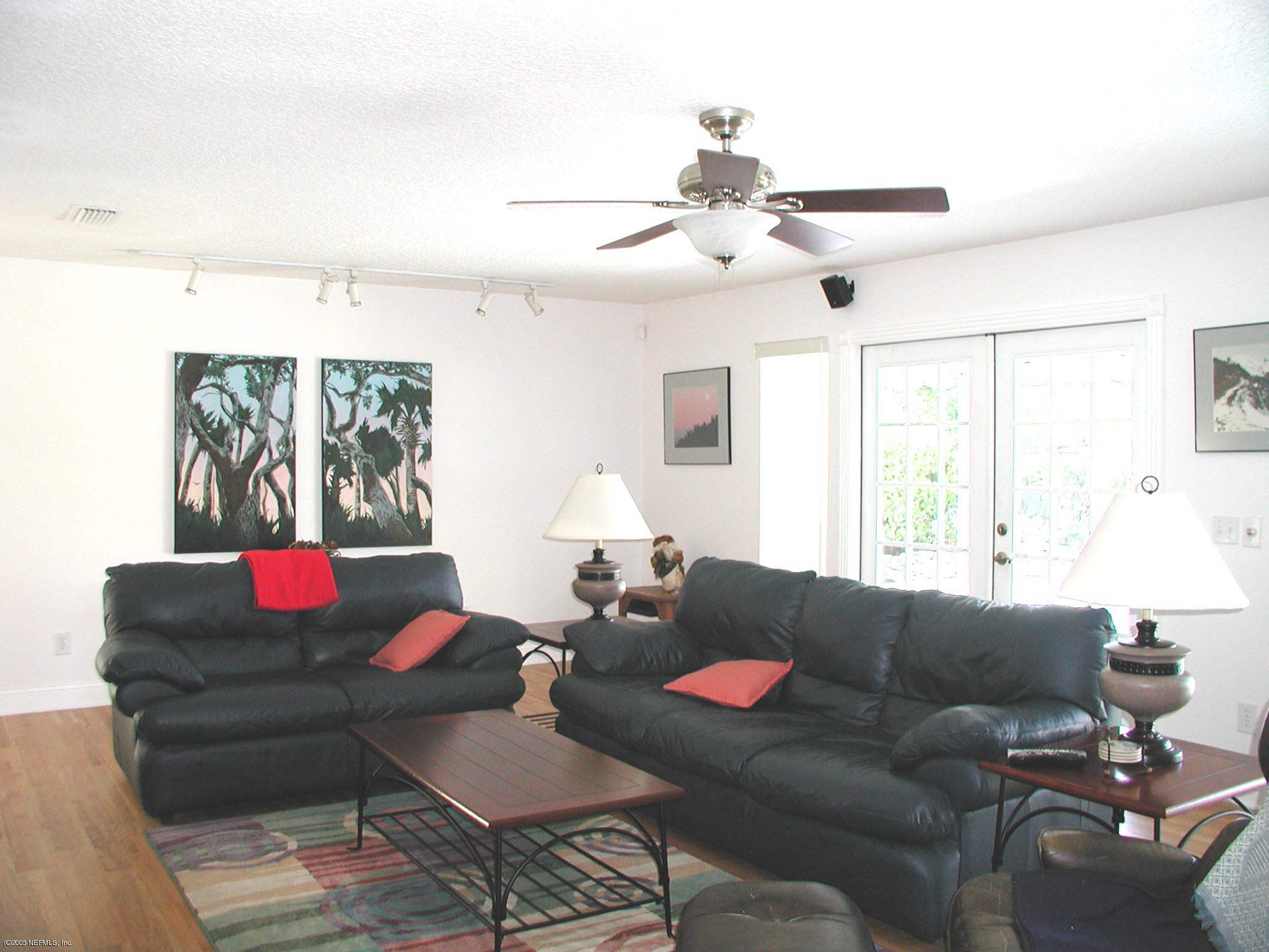 79 Shell Street Atlantic Beach, FL 32233 - Photo 13 of 20 Living Room has Wood Plank Floors