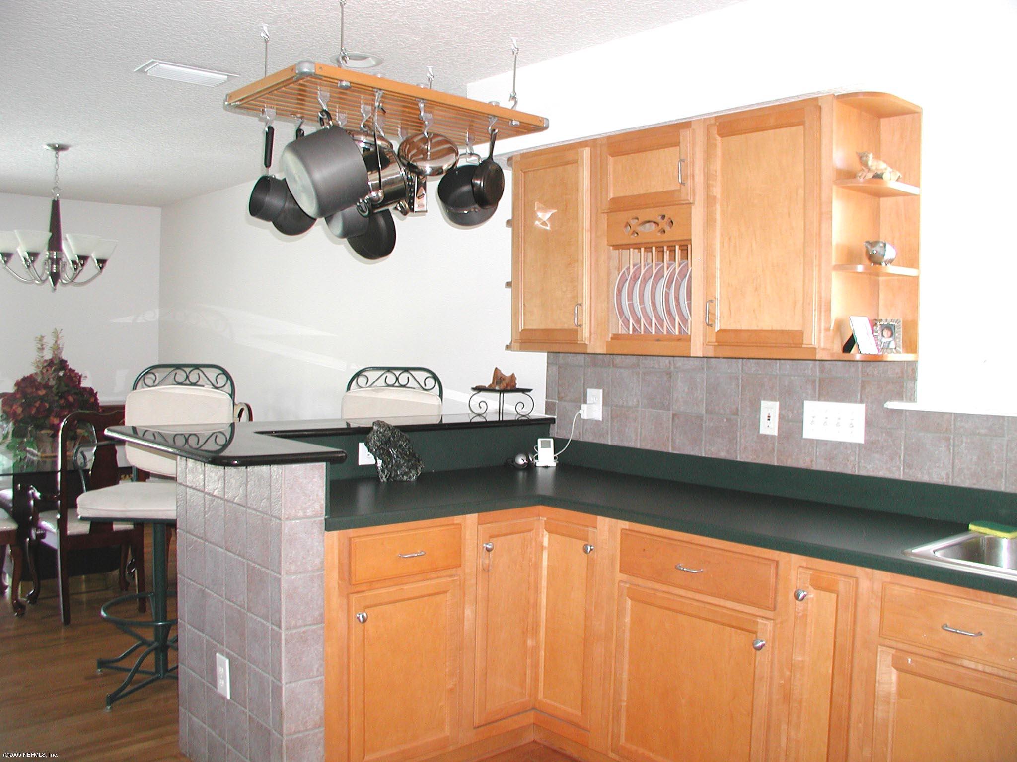 79 Shell Street Atlantic Beach, FL 32233 - Photo 17 of 20 Breakfast Bar features a Granite Counter