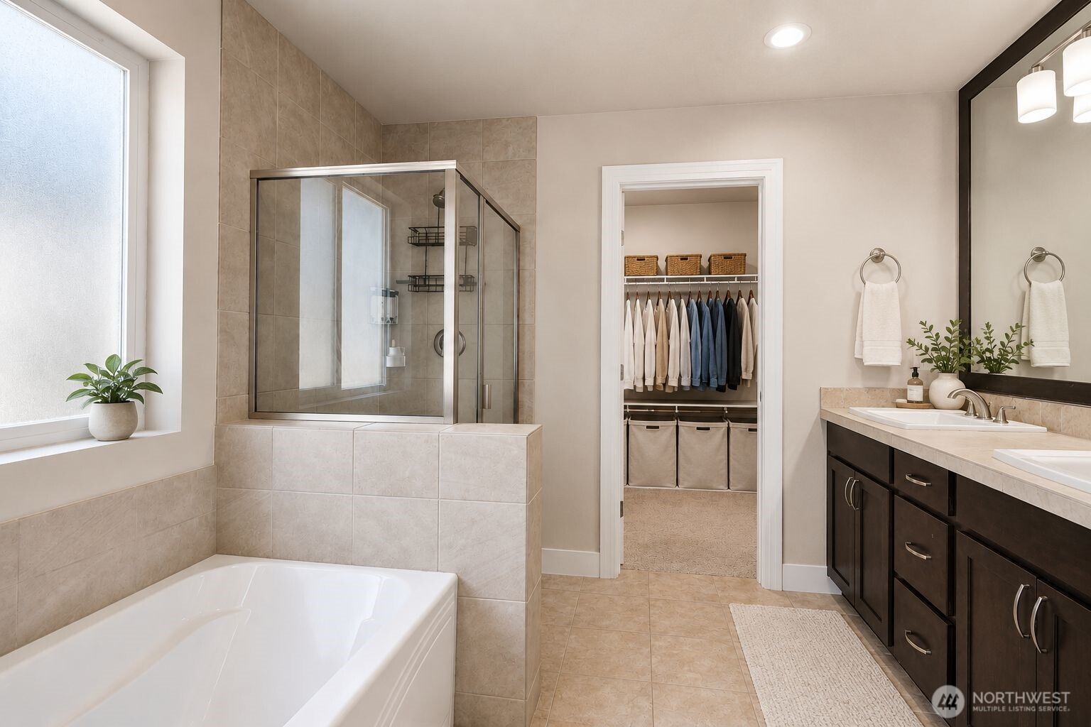 19607 25th Drive Southeast Bothell, WA 98012 - Photo 16 of 30 a spacious bathroom with a tub a sink and mirrors