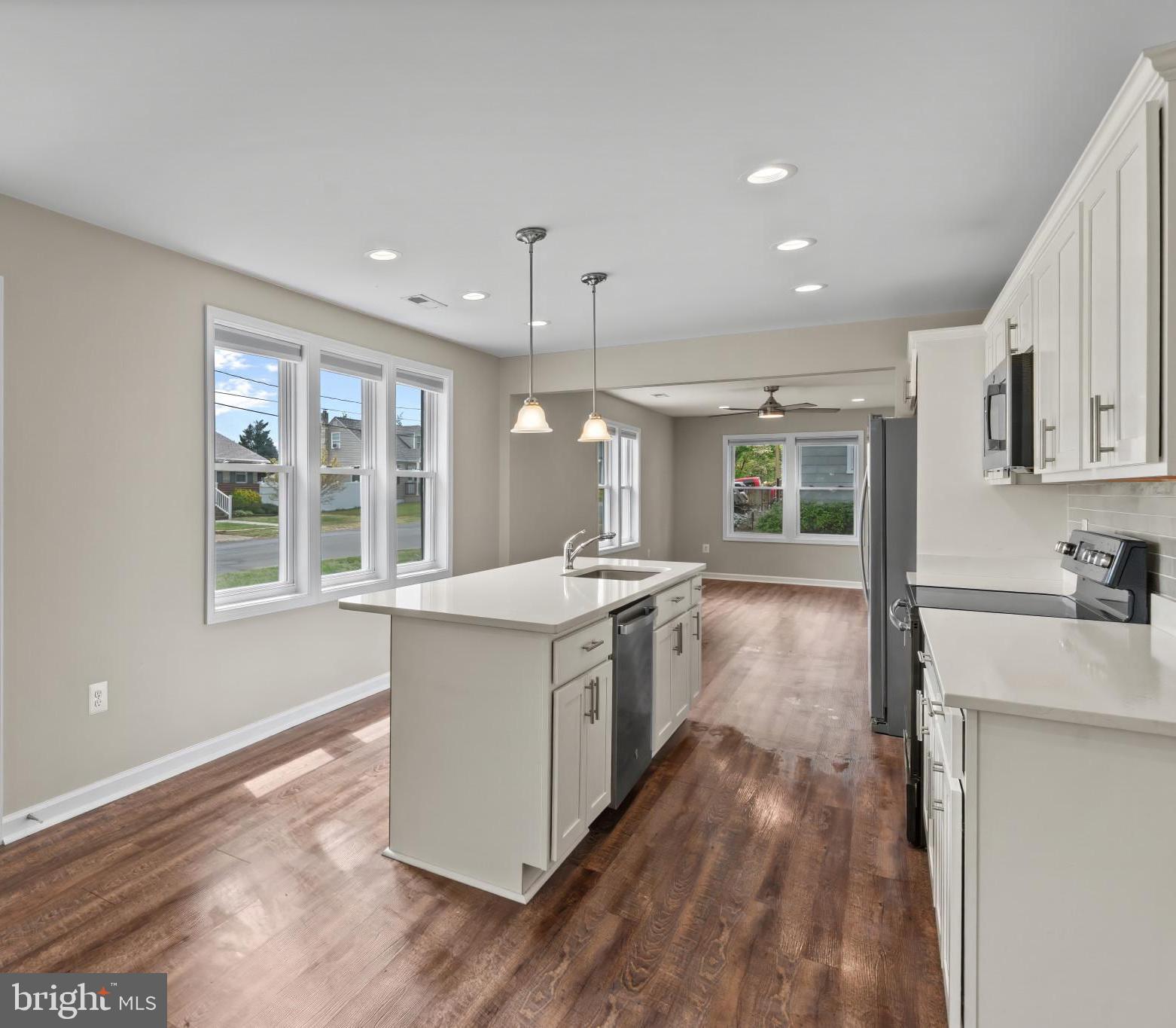 14 Montrose Road Pasadena, MD 21122 - Photo 12 of 19 a kitchen with stove and wooden floor