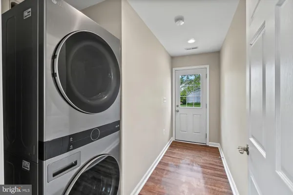 a view of a hallway with washer and dryer