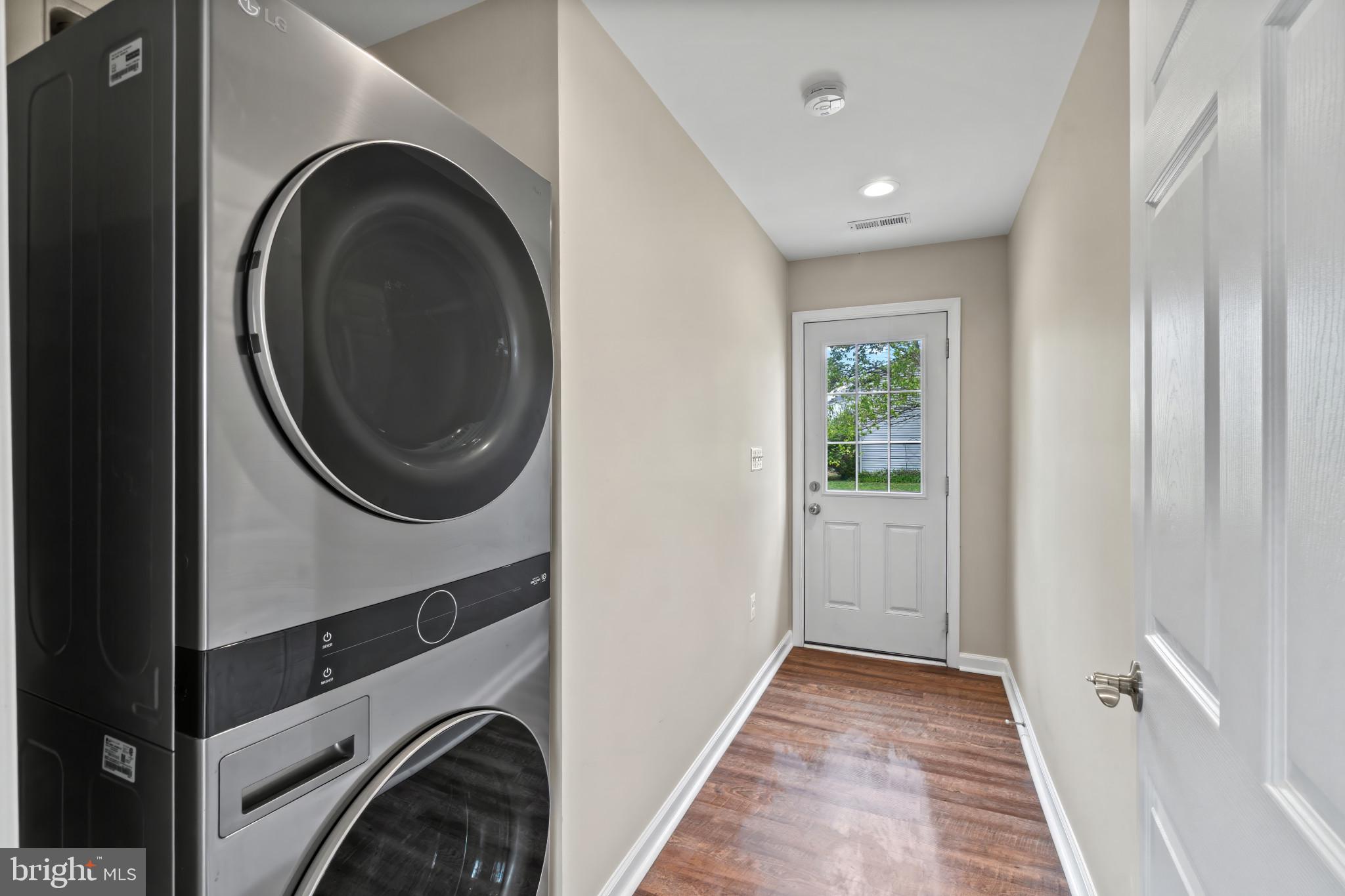 14 Montrose Road Pasadena, MD 21122 - Photo 19 of 19 a view of a hallway with washer and dryer