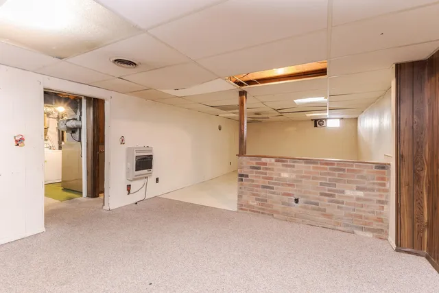 a bathroom with a toilet and a shower curtain