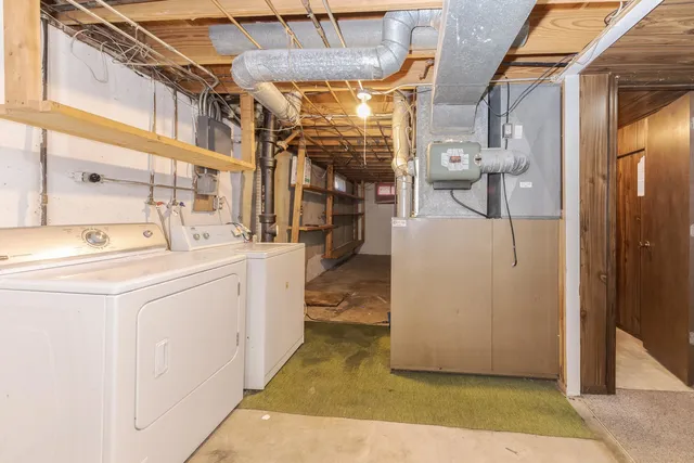 a view of storage and utility room with closet