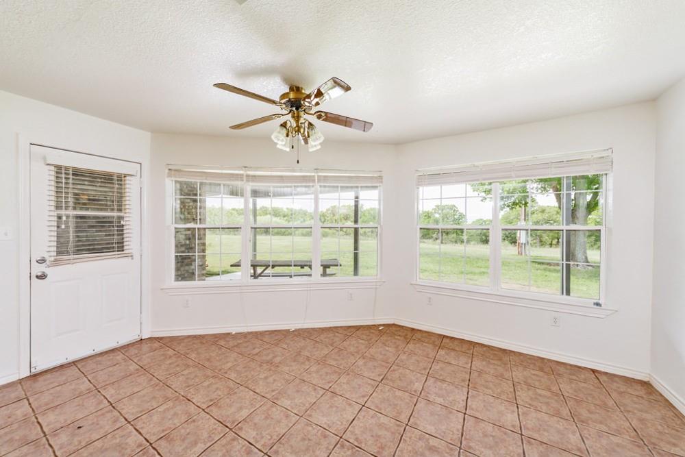 4316 Leona Road Bowie, TX 76230 - Photo 8 of 37 a view of an empty room with a window