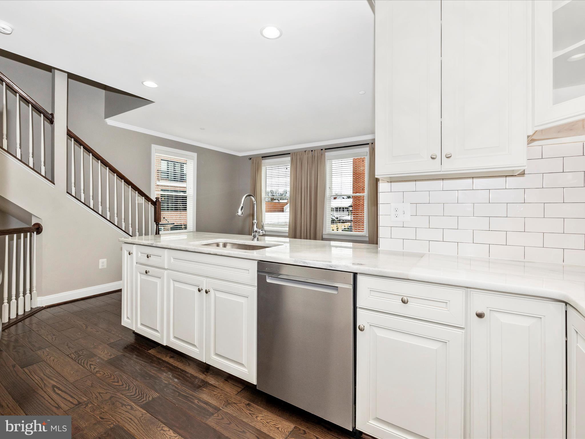 2 Maxwell Square Frederick, MD 21701 - Photo 13 of 59 a kitchen with granite countertop white cabinets and white appliances