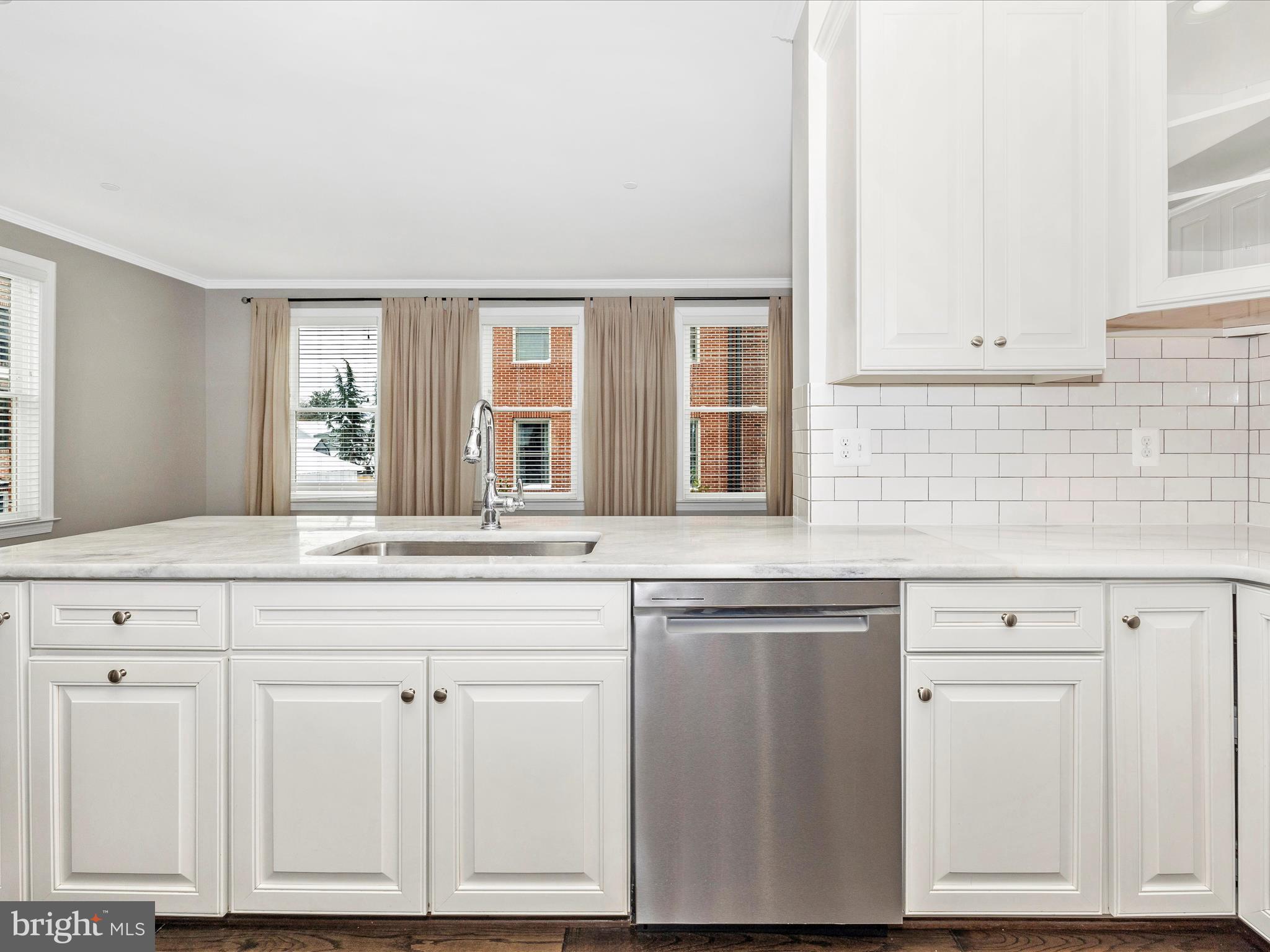 2 Maxwell Square Frederick, MD 21701 - Photo 14 of 59 a kitchen with white cabinets and sink