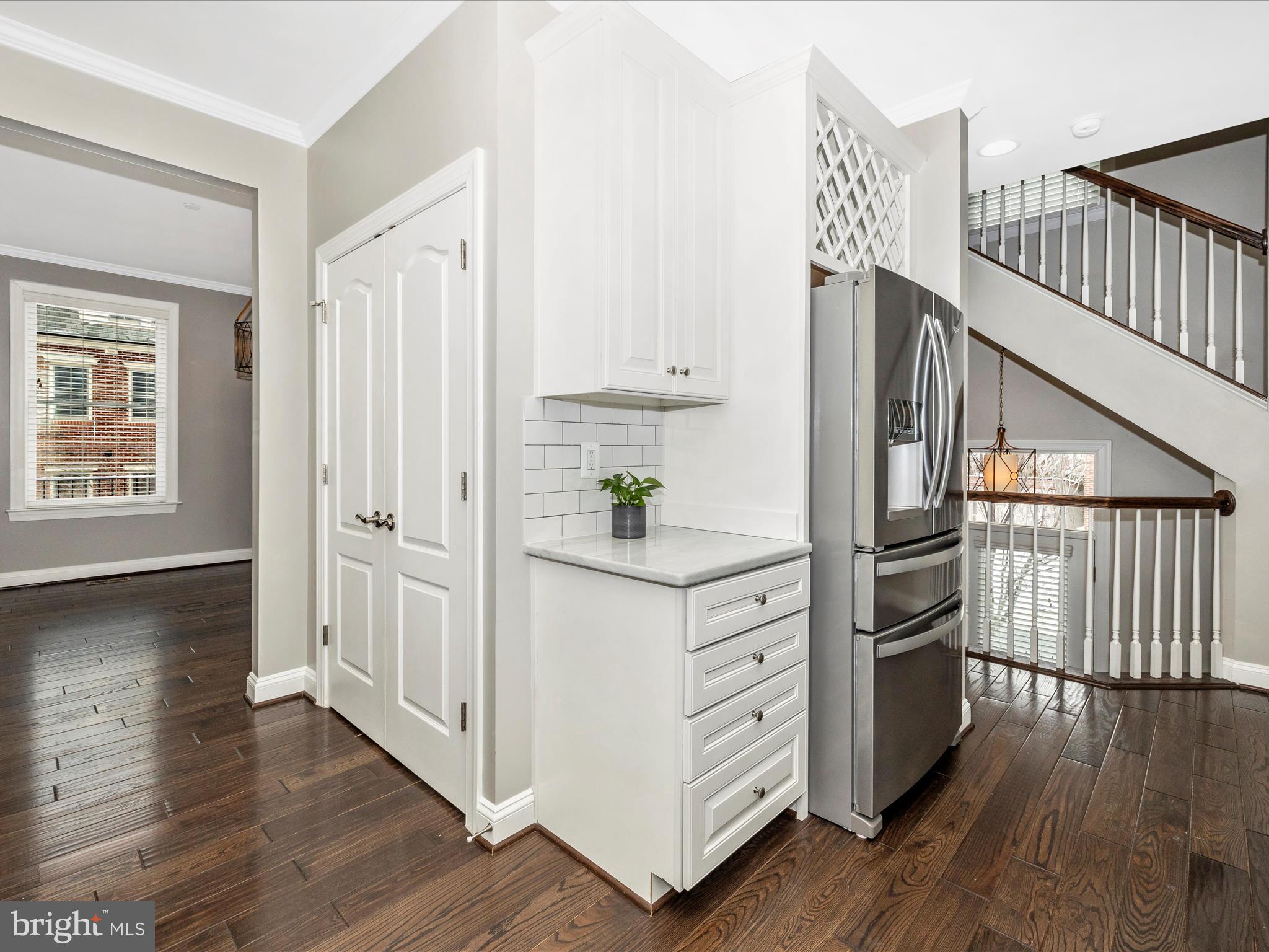 2 Maxwell Square Frederick, MD 21701 - Photo 15 of 59 a view of kitchen and hallway with wooden floor