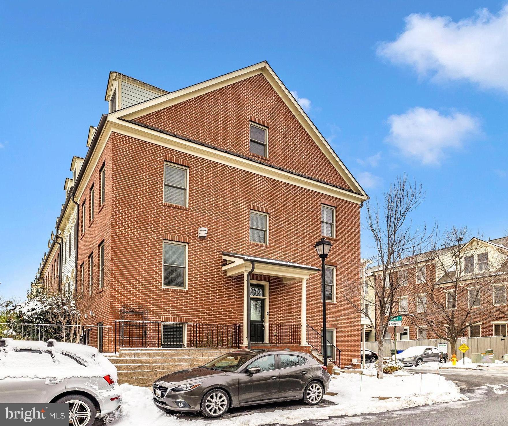 2 Maxwell Square Frederick, MD 21701 - Photo 2 of 59 a front view of a residential apartment building with a yard